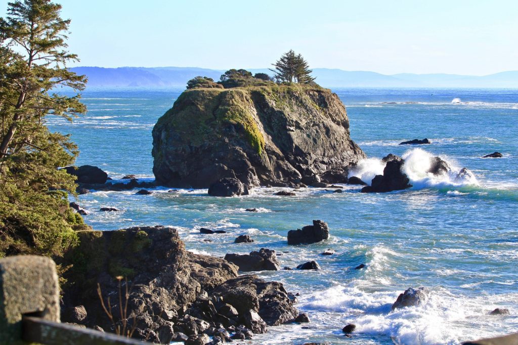 Image of guided meditation at Pebble beach, video blog, vlog, blog to video, Large rock